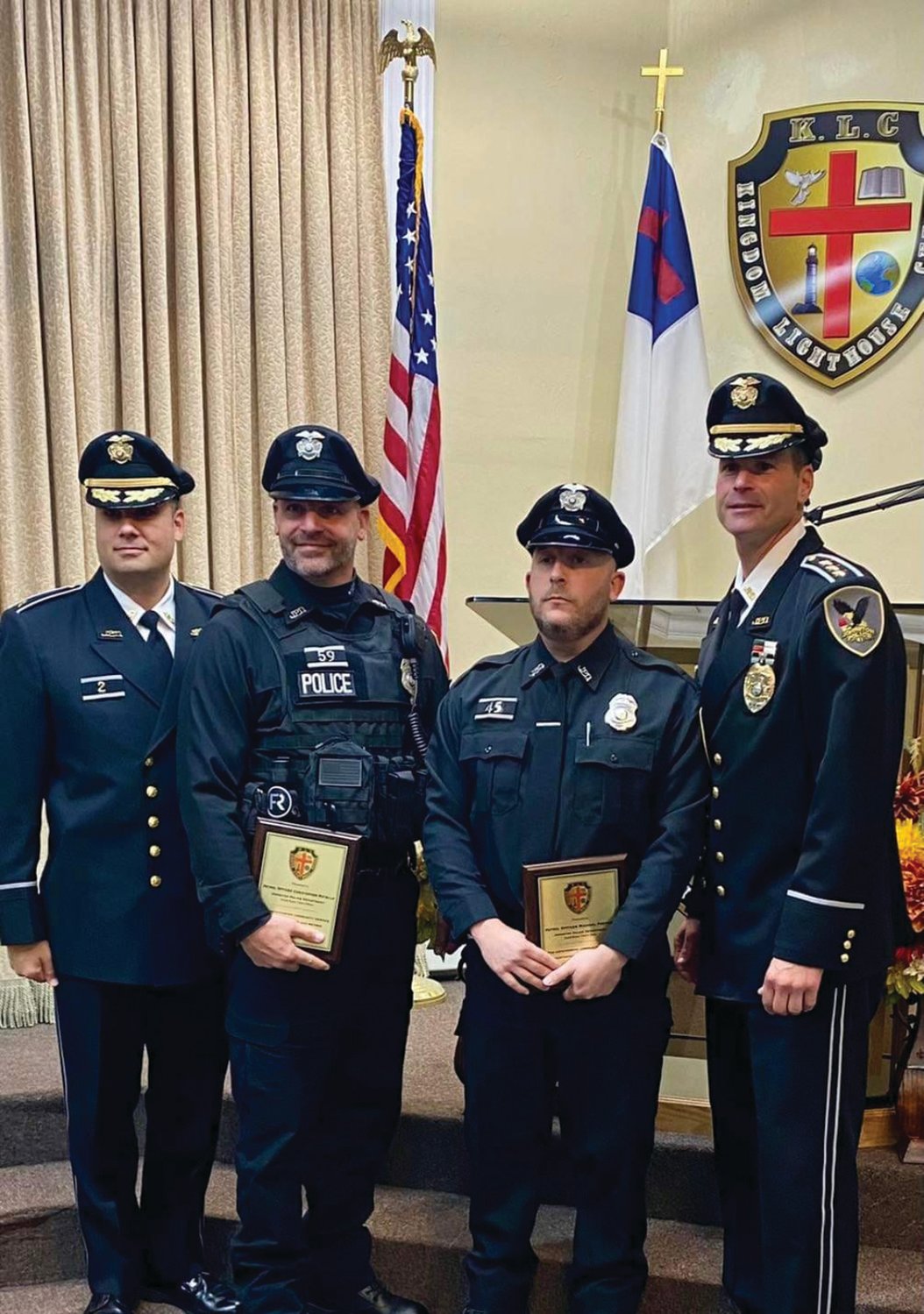 DUTY PERFORMED, ABOVE AND BEYOND: Johnston Police Patrolmen Michael Protano and Christopher Rotella were honored recently  and formally recognized with Community Service Awards for performing above and beyond the call of duty during the recent arrest of a wanted suspect. Johnston police extended “thanks to Bishop Femi Owoyemi and the entire congregation of Kingdom Lighthouse Church, for hosting the ceremony and recognizing the outstanding commitment of both officers,” in a statement on the department’s Facebook page.